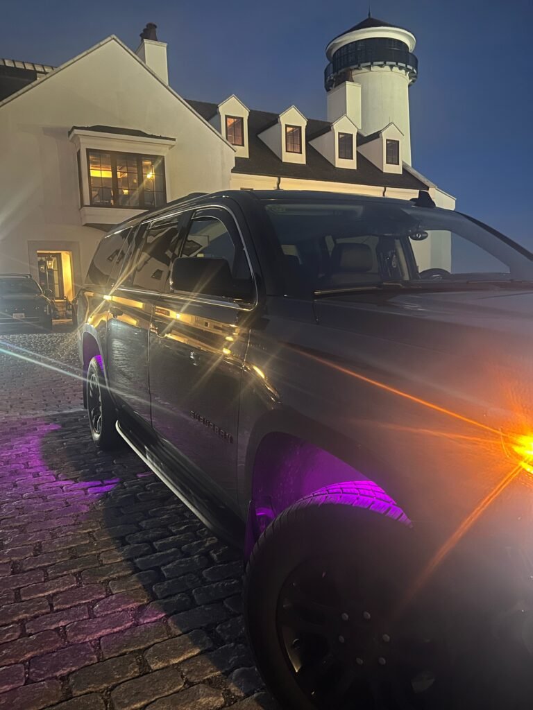 SUV with purple underglow lighting parked at night in Summit, NJ