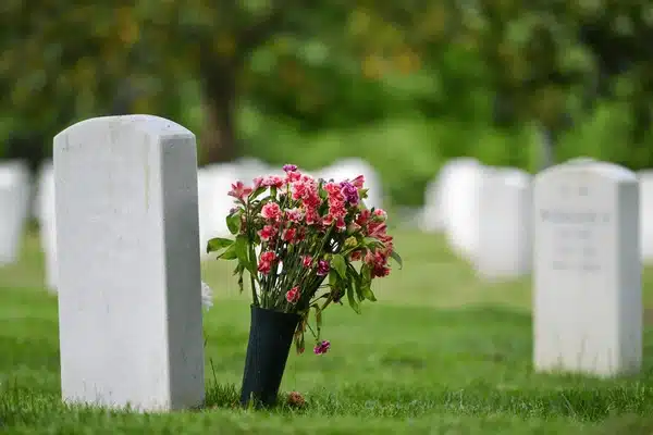 Black luxury SUV parked near a cemetery for respectful funeral transportation in New Jersey