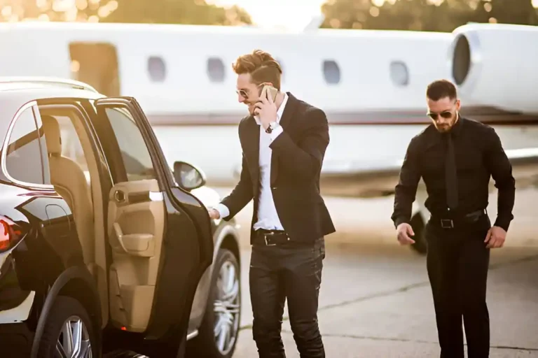 Executive chauffeur opening car door at Newark Airport for private EWR car service